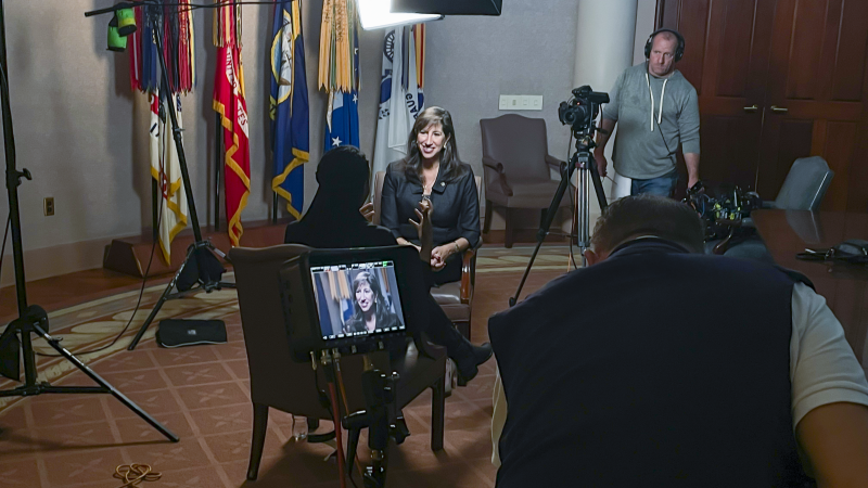 Paige Alexander sits for a media interview.